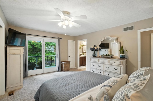 96 Executive Ct Unit B, Westerville, OH 43081 - bedroom with access to outside, light carpet, a textured ceiling, ensuite bath, and ceiling fan