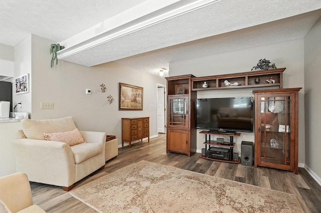 96 Executive Ct Unit B, Westerville, OH 43081 - living room with wood finished floors and a textured ceiling
