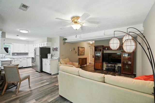 96 Executive Ct Unit B, Westerville, OH 43081 - living room with dark wood-style flooring and a ceiling fan
