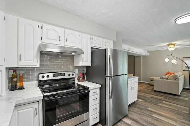 96 Executive Ct Unit B, Westerville, OH 43081 - kitchen featuring appliances with stainless steel finishes, under cabinet range hood, open floor plan, decorative backsplash, and white cabinetry