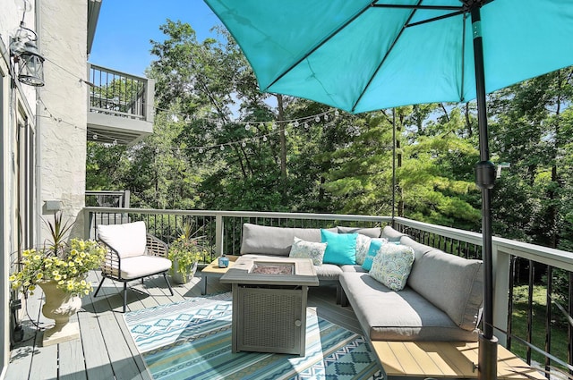 96 Executive Ct Unit B, Westerville, OH 43081 - wooden deck featuring an outdoor living space with a fire pit and view of scattered trees