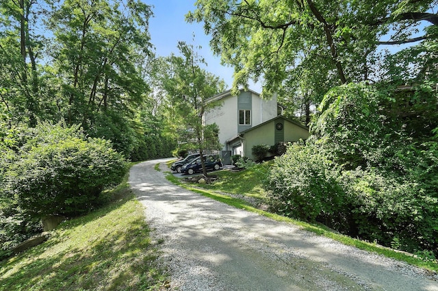 96 Executive Ct Unit B, Westerville, OH 43081 - view of side of property with gravel driveway and stucco siding