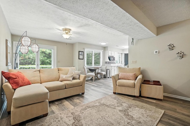 96 Executive Ct Unit B, Westerville, OH 43081 - living room featuring wood finished floors, a ceiling fan, and a textured ceiling