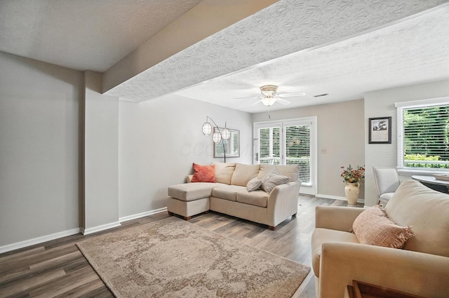 96 Executive Ct Unit B, Westerville, OH 43081 - living area featuring ceiling fan, wood finished floors, and a textured ceiling