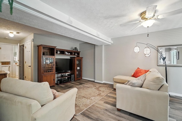 96 Executive Ct Unit B, Westerville, OH 43081 - living area with a textured ceiling, wood finished floors, and ceiling fan