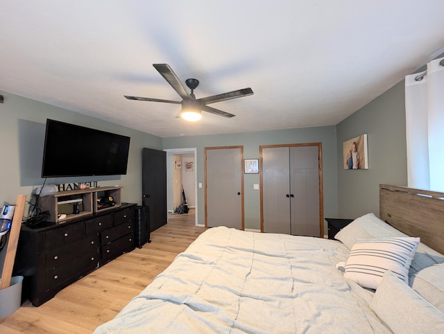 3439 Rough And Ready Rd, New Concord, OH 43762 - bedroom with light wood-style floors, multiple closets, and ceiling fan