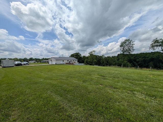3439 Rough And Ready Rd, New Concord, OH 43762 - view of green lawn with a garage and a forest view