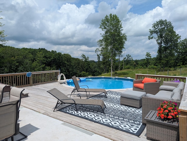 3439 Rough And Ready Rd, New Concord, OH 43762 - outdoor pool featuring a wooden deck and a wooded view