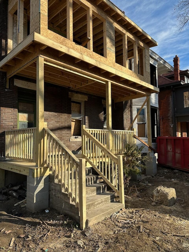1703 Bryden Rd, Columbus, OH 43205 - view of home's exterior with brick siding, stairway, and a porch