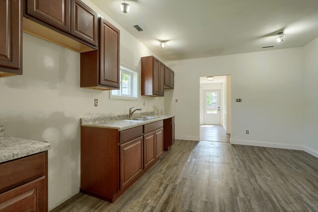 424 N Walnut St, Logan, OH 43138 - kitchen with wood finished floors, healthy amount of natural light, and light countertops