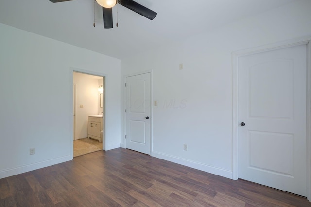 424 N Walnut St, Logan, OH 43138 - unfurnished bedroom with dark wood-style flooring, connected bathroom, and a ceiling fan