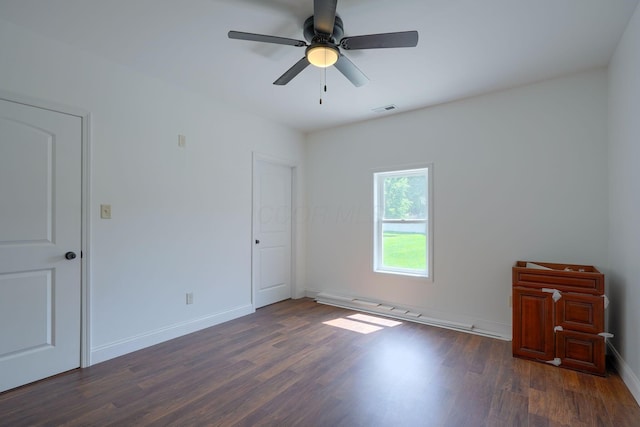 424 N Walnut St, Logan, OH 43138 - unfurnished bedroom featuring dark wood finished floors and ceiling fan