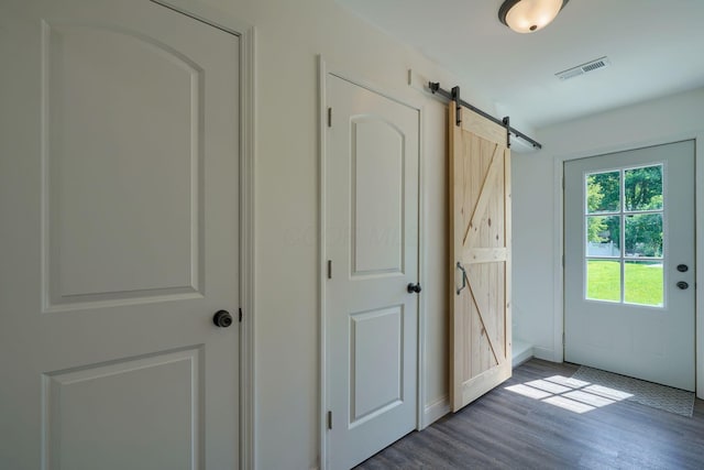 424 N Walnut St, Logan, OH 43138 - entryway featuring a barn door and wood finished floors