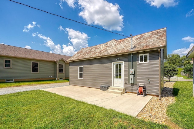 424 N Walnut St, Logan, OH 43138 - rear view of property with a lawn and a patio area