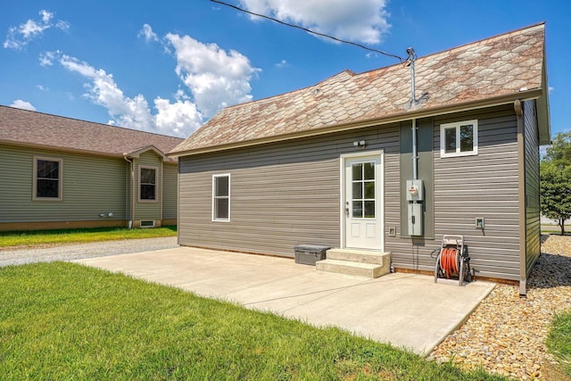 424 N Walnut St, Logan, OH 43138 - back of property with a patio area and a yard