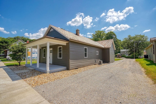 424 N Walnut St, Logan, OH 43138 - view of property exterior with covered porch and a chimney