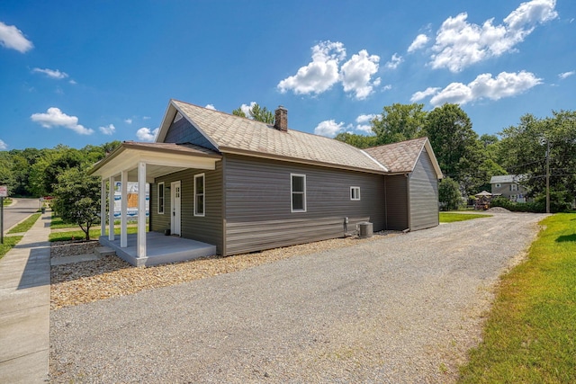 424 N Walnut St, Logan, OH 43138 - view of property exterior featuring a porch and a chimney