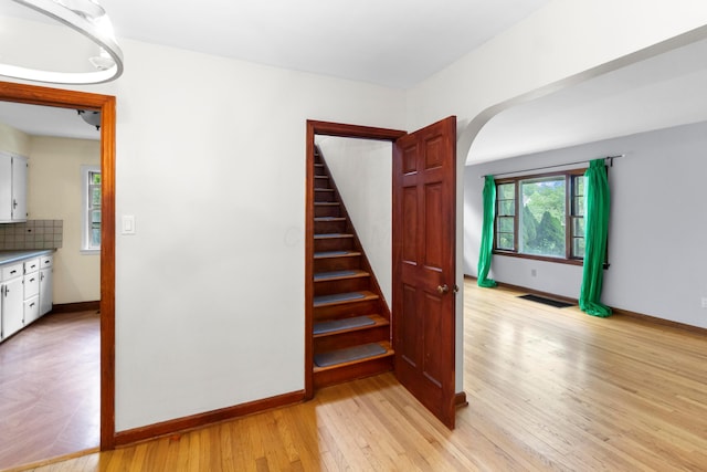206 Lintner St, Columbus, OH 43230 - staircase with wood finished floors and arched walkways
