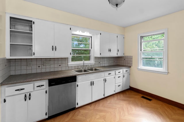 206 Lintner St, Columbus, OH 43230 - kitchen with stainless steel dishwasher, plenty of natural light, white cabinetry, and tasteful backsplash