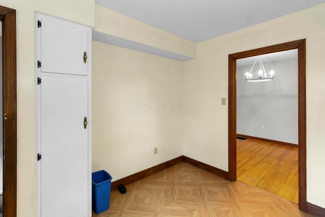 206 Lintner St, Columbus, OH 43230 - unfurnished room featuring a chandelier and baseboards