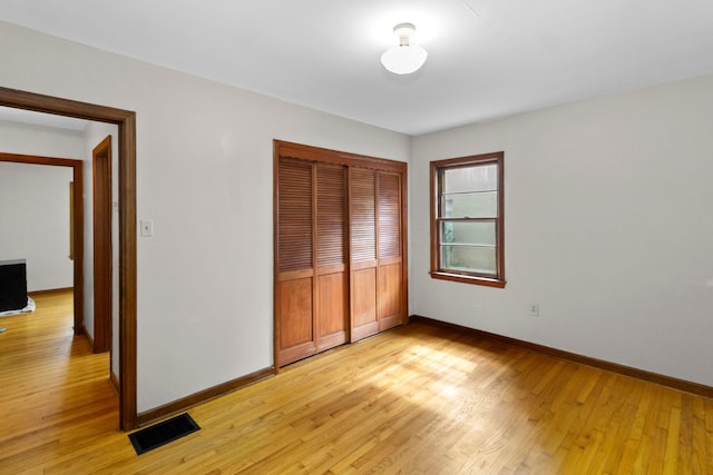 206 Lintner St, Columbus, OH 43230 - unfurnished bedroom with light wood-type flooring and a closet