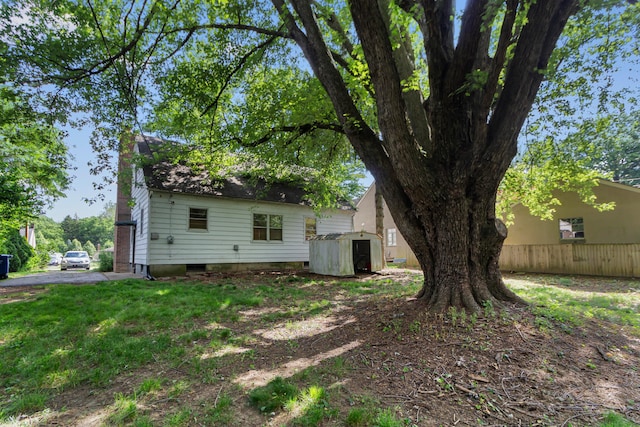 206 Lintner St, Columbus, OH 43230 - rear view of house featuring a storage unit