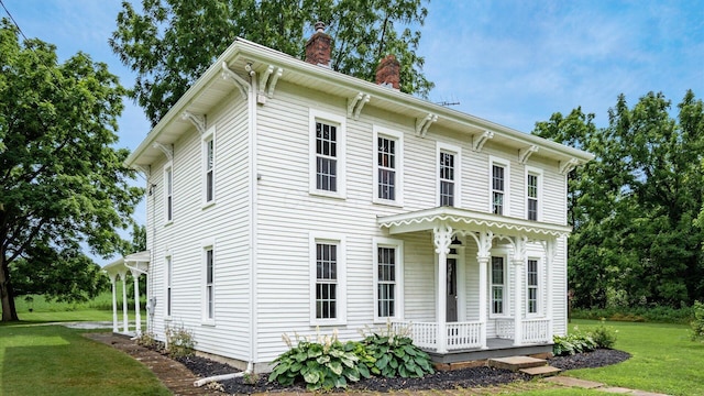 5377 Moots Run Rd, Alexandria, OH 43001 - view of front of home with a porch, a chimney, and a front lawn