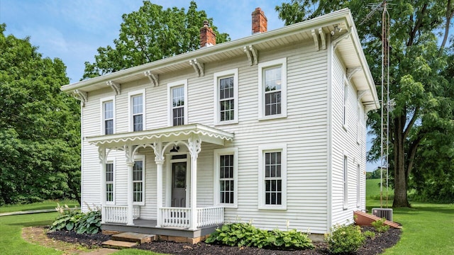 5377 Moots Run Rd, Alexandria, OH 43001 - italianate house featuring a chimney, a porch, and a front yard