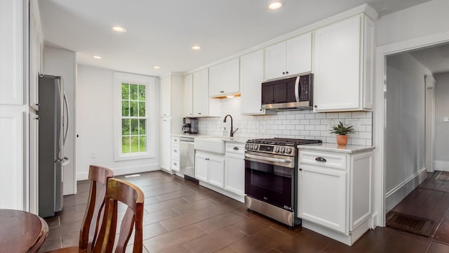 5377 Moots Run Rd, Alexandria, OH 43001 - kitchen with stainless steel appliances, backsplash, white cabinets, light stone countertops, and recessed lighting