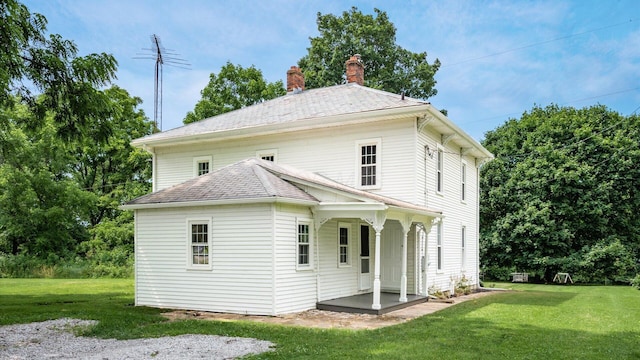 5377 Moots Run Rd, Alexandria, OH 43001 - back of property featuring a chimney, a yard, and a shingled roof