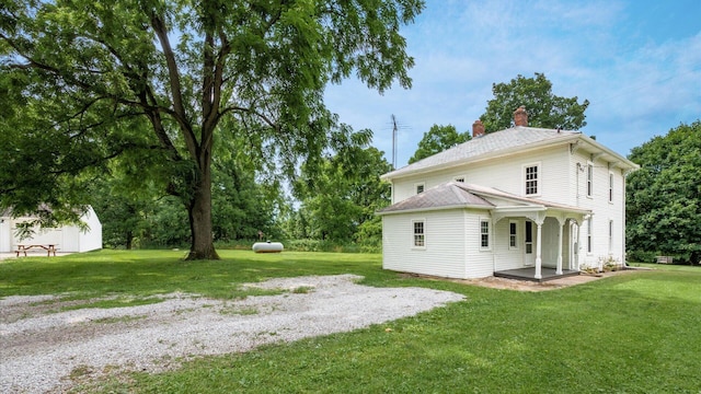 5377 Moots Run Rd, Alexandria, OH 43001 - rear view of house featuring a chimney and a lawn