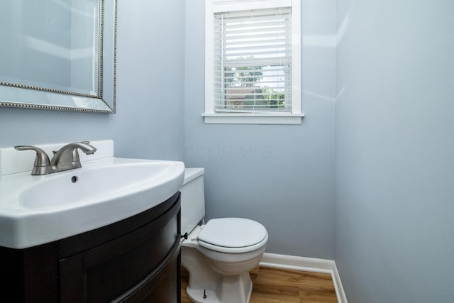 922 Afton Rd, Columbus, OH 43221 - bathroom with wood finished floors and vanity