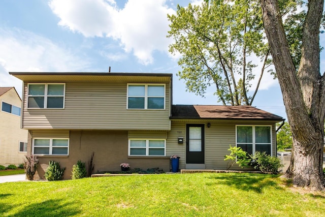 922 Afton Rd, Columbus, OH 43221 - split level home featuring a front yard and brick siding