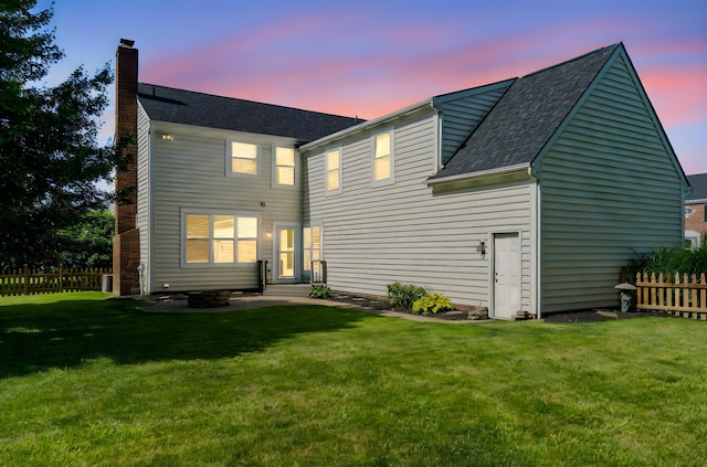 4884 Alston Grove Dr, Westerville, OH 43082 - back of property at dusk featuring a chimney and a shingled roof