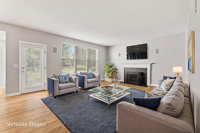 4884 Alston Grove Dr, Westerville, OH 43082 - living room with light wood finished floors and a tiled fireplace