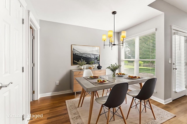4884 Alston Grove Dr, Westerville, OH 43082 - dining space with wood finished floors and a chandelier