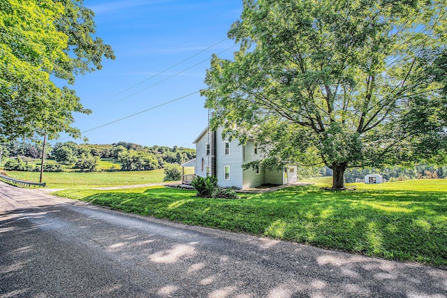 2883 Tucker Rd, Lucas, OH 44843 - view of side of home featuring a lawn