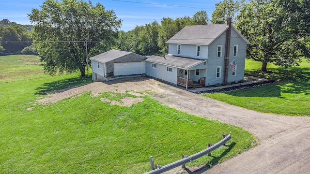2883 Tucker Rd, Lucas, OH 44843 - view of front of house with dirt driveway, a chimney, a front lawn, and roof with shingles