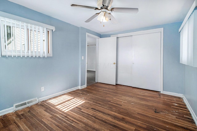 2883 Tucker Rd, Lucas, OH 44843 - unfurnished bedroom featuring hardwood / wood-style floors, a closet, and a ceiling fan