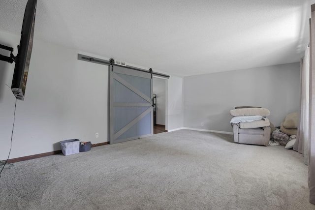 372 Depauw Ct, Columbus, OH 43230 - interior space with a textured ceiling, carpet, and a barn door