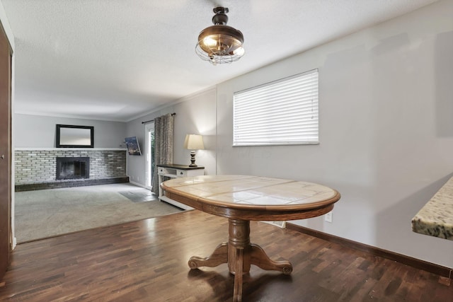 372 Depauw Ct, Columbus, OH 43230 - dining room with a fireplace and wood finished floors
