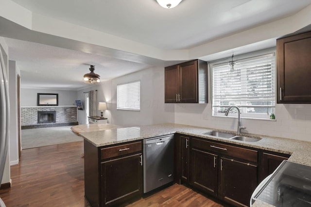 372 Depauw Ct, Columbus, OH 43230 - kitchen featuring stainless steel dishwasher, a peninsula, open floor plan, dark brown cabinets, and dark wood-style floors