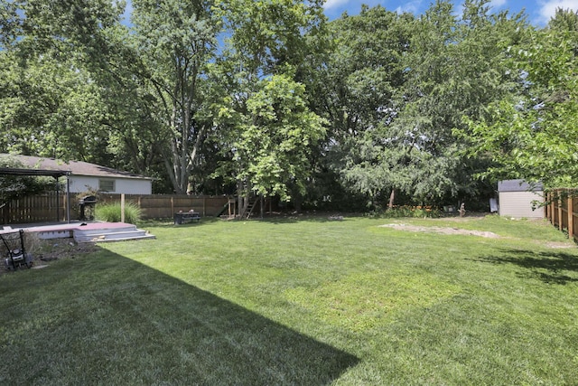 372 Depauw Ct, Columbus, OH 43230 - fenced backyard featuring a storage unit and a wooden deck