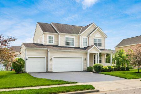 1883 Caplinger Dr, Grove City, OH 43123 - view of front of house with driveway, a front lawn, and a garage