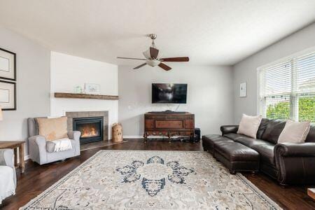 1883 Caplinger Dr, Grove City, OH 43123 - living area with ceiling fan, wood finished floors, and a fireplace with flush hearth