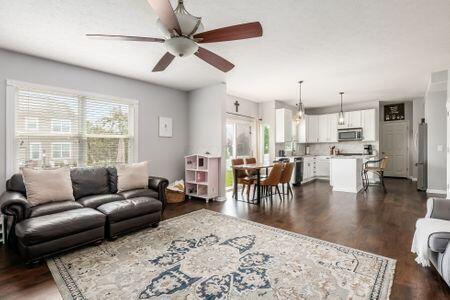 1883 Caplinger Dr, Grove City, OH 43123 - living room featuring a ceiling fan and dark wood-style floors