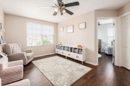 1883 Caplinger Dr, Grove City, OH 43123 - living area with ceiling fan and wood finished floors