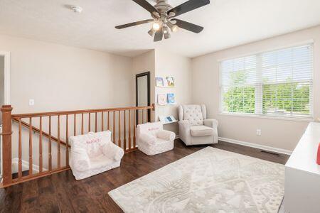 1883 Caplinger Dr, Grove City, OH 43123 - sitting room with ceiling fan, wood finished floors, and an upstairs landing