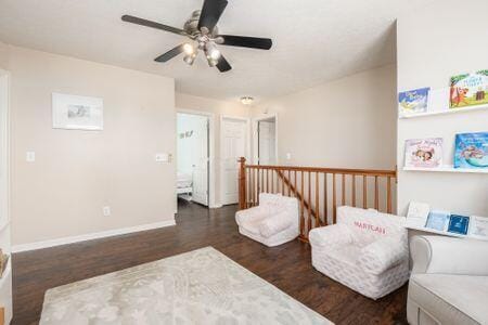 1883 Caplinger Dr, Grove City, OH 43123 - living area featuring an upstairs landing, wood finished floors, and ceiling fan