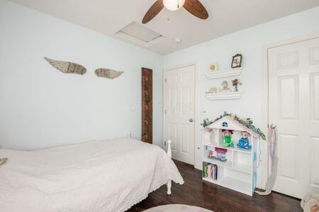 1883 Caplinger Dr, Grove City, OH 43123 - bedroom with wood finished floors, attic access, and a ceiling fan